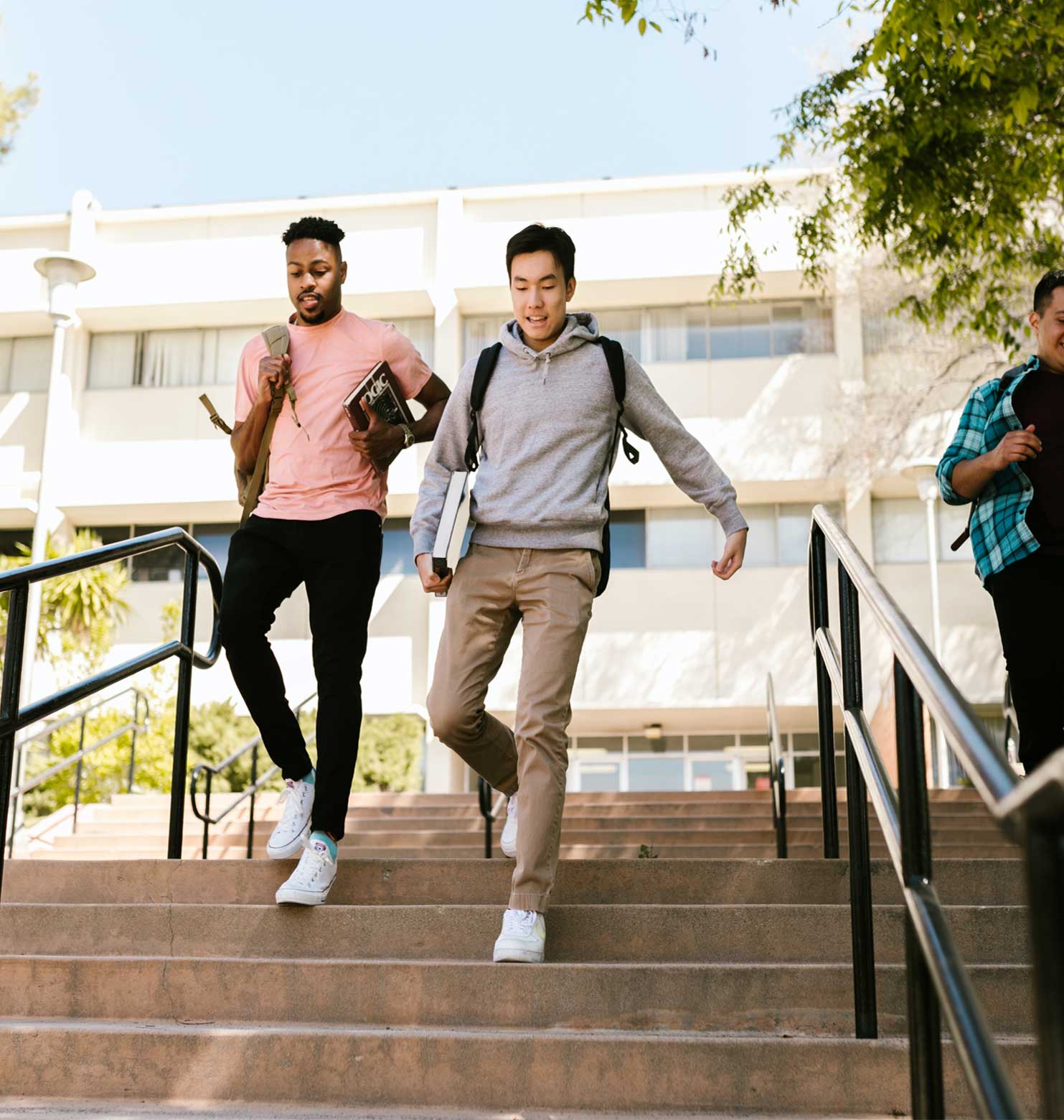 students quickly going down the stairs